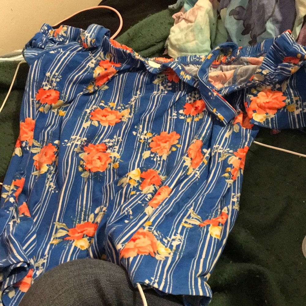 blue off the shoulder shirt with flowers